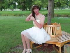 Crossdressing Princess sitting in the Park